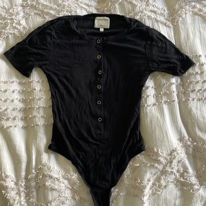 Privacy Plus black short sleeve bodysuit.